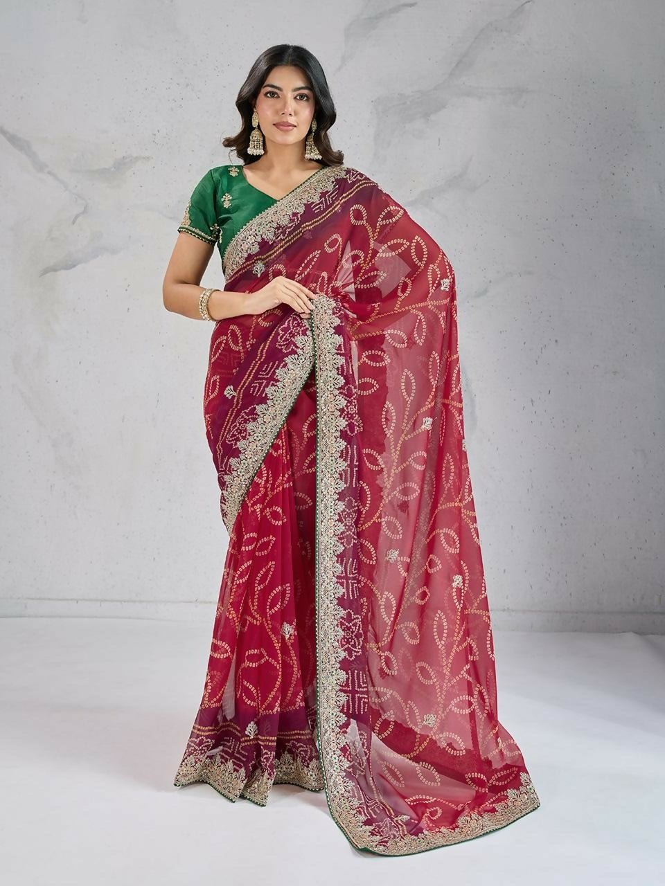 Vibrant red georgette saree with modern digital print and a contrasting green blouse