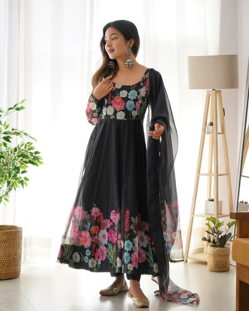 A black organza kurta set featuring elegant sequin embroidery work and matching cotton bottom.