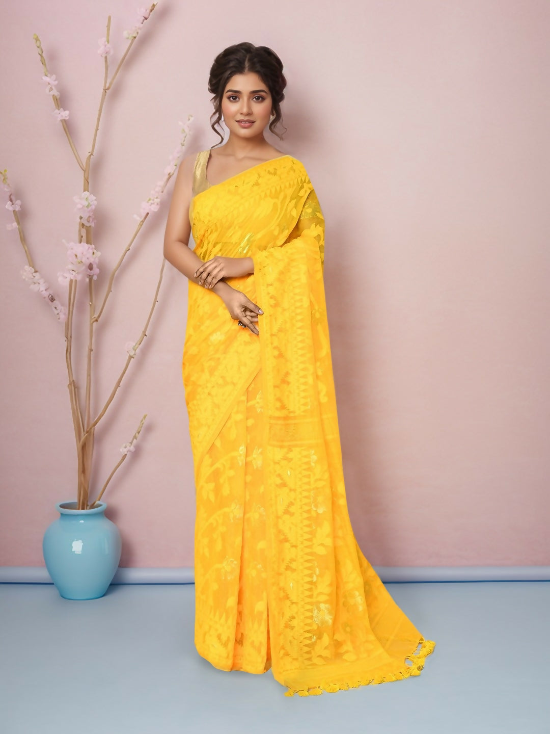 Beautiful yellow cotton blend Jamdani saree with intricate traditional weaving patterns.