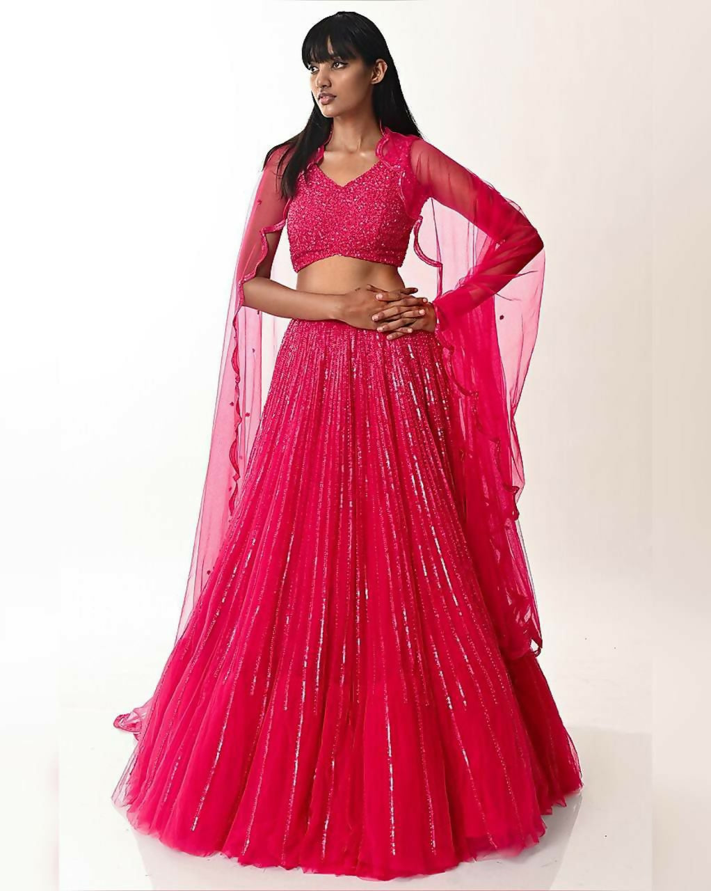 Rani Pink double layer net lehenga choli with sequins and voluminous flare