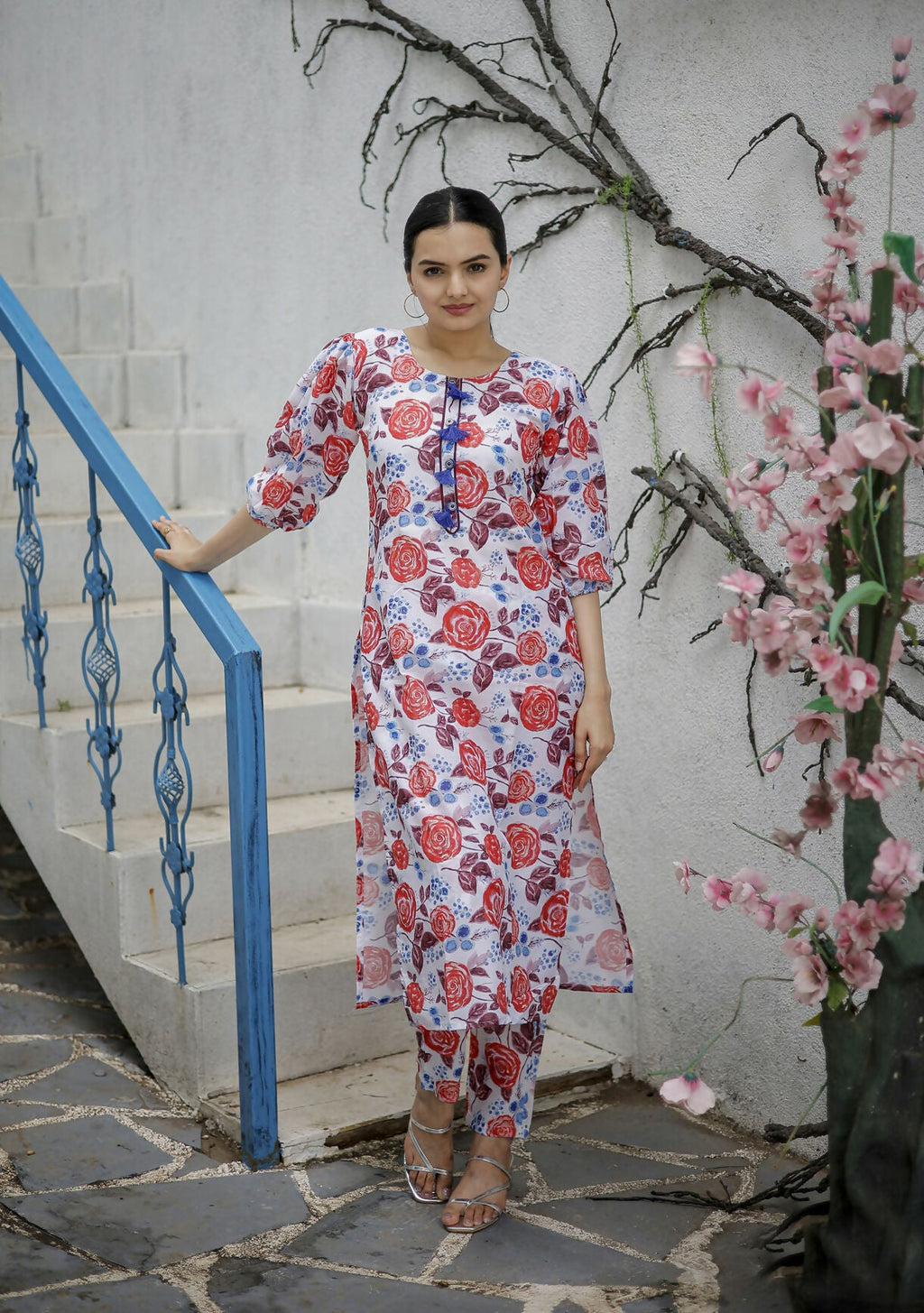 Women wearing a multicolor A-line pure muslin kurta with heavy digital print and matching pants.