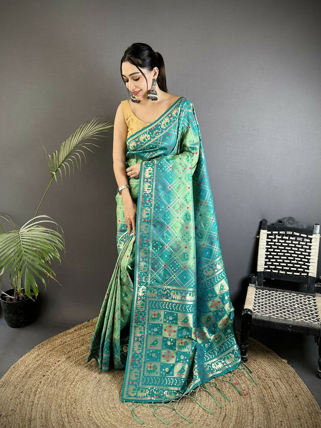 Turquoise soft silk Patola saree with geometric pattern and matching blouse piece