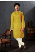 Bright yellow cotton kurta pyjama set for babies paired with off-white bottoms