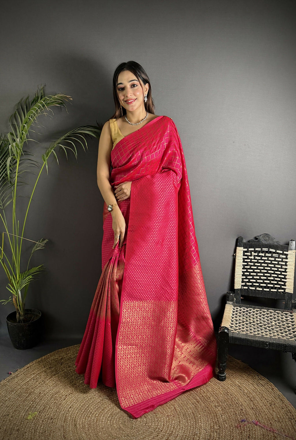Hot pink Banarasi soft Lichi silk saree with intricate woven checks and traditional border.