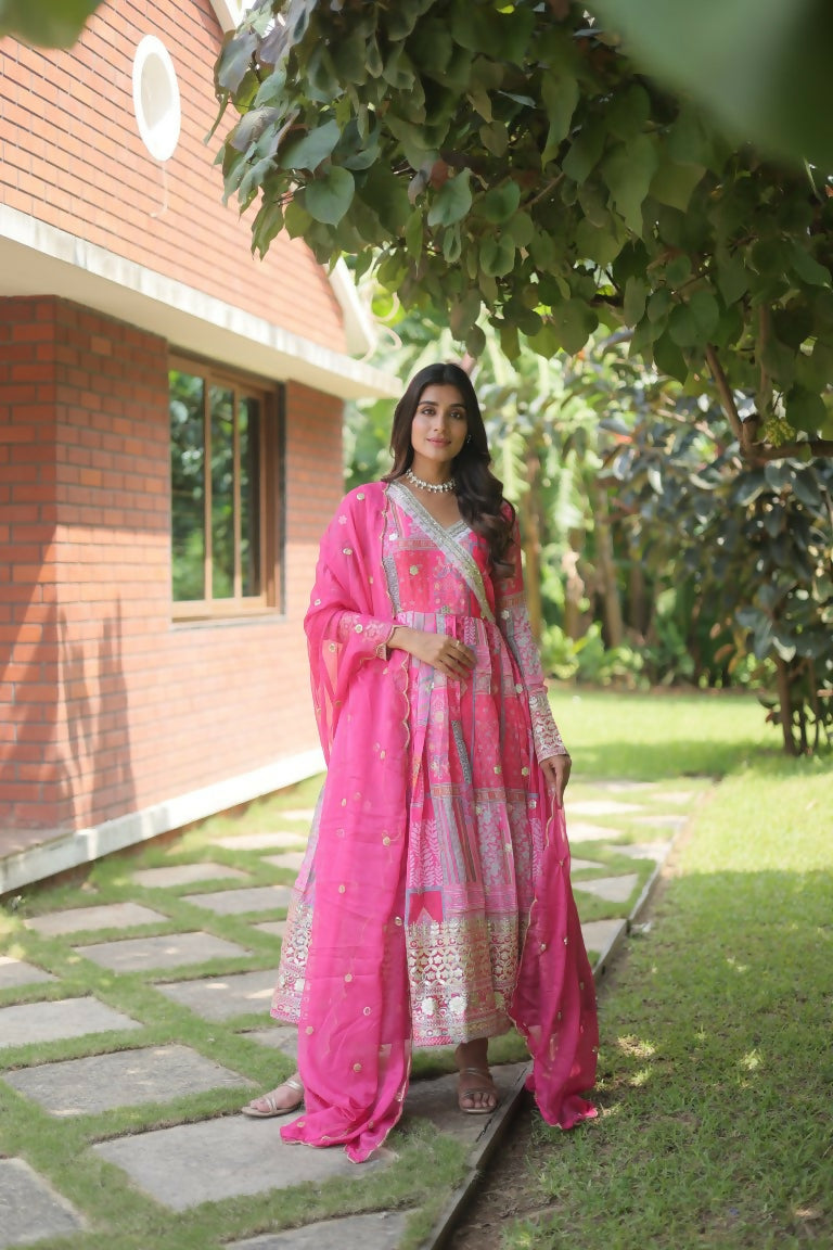 Pink Russian Silk Anarkali dress with abstract digital prints and intricate embroidery, including a dupatta.