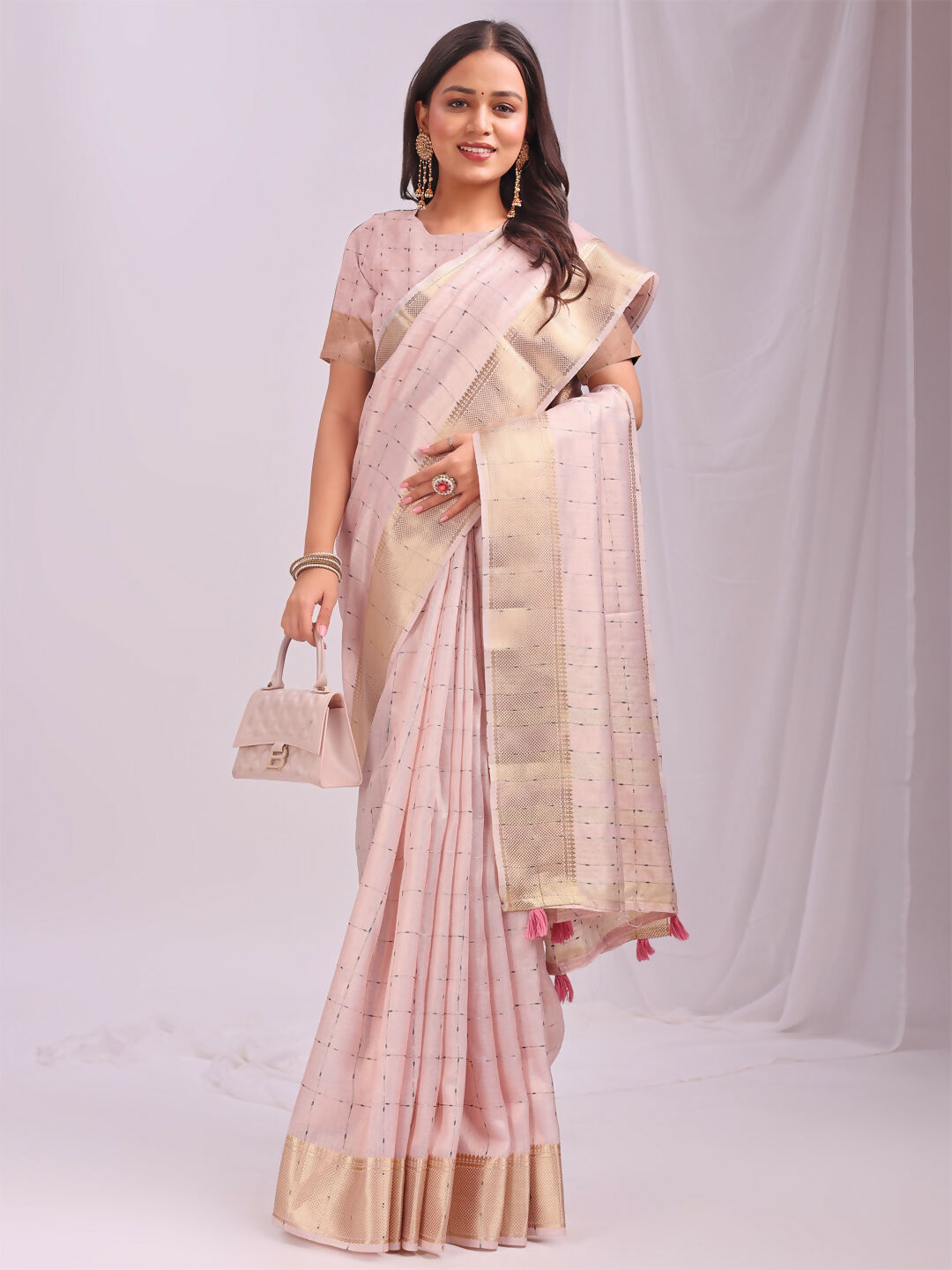 Peach organza saree with matching fabric for a coordinated ethnic look