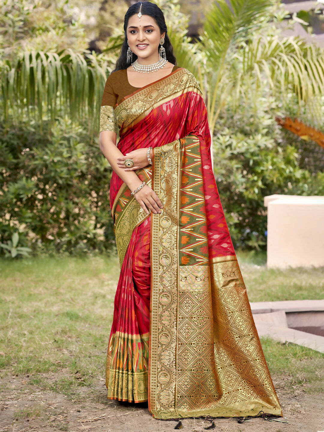 A elegant red Pochampally silk saree with matching blouse fabric on a neutral background.