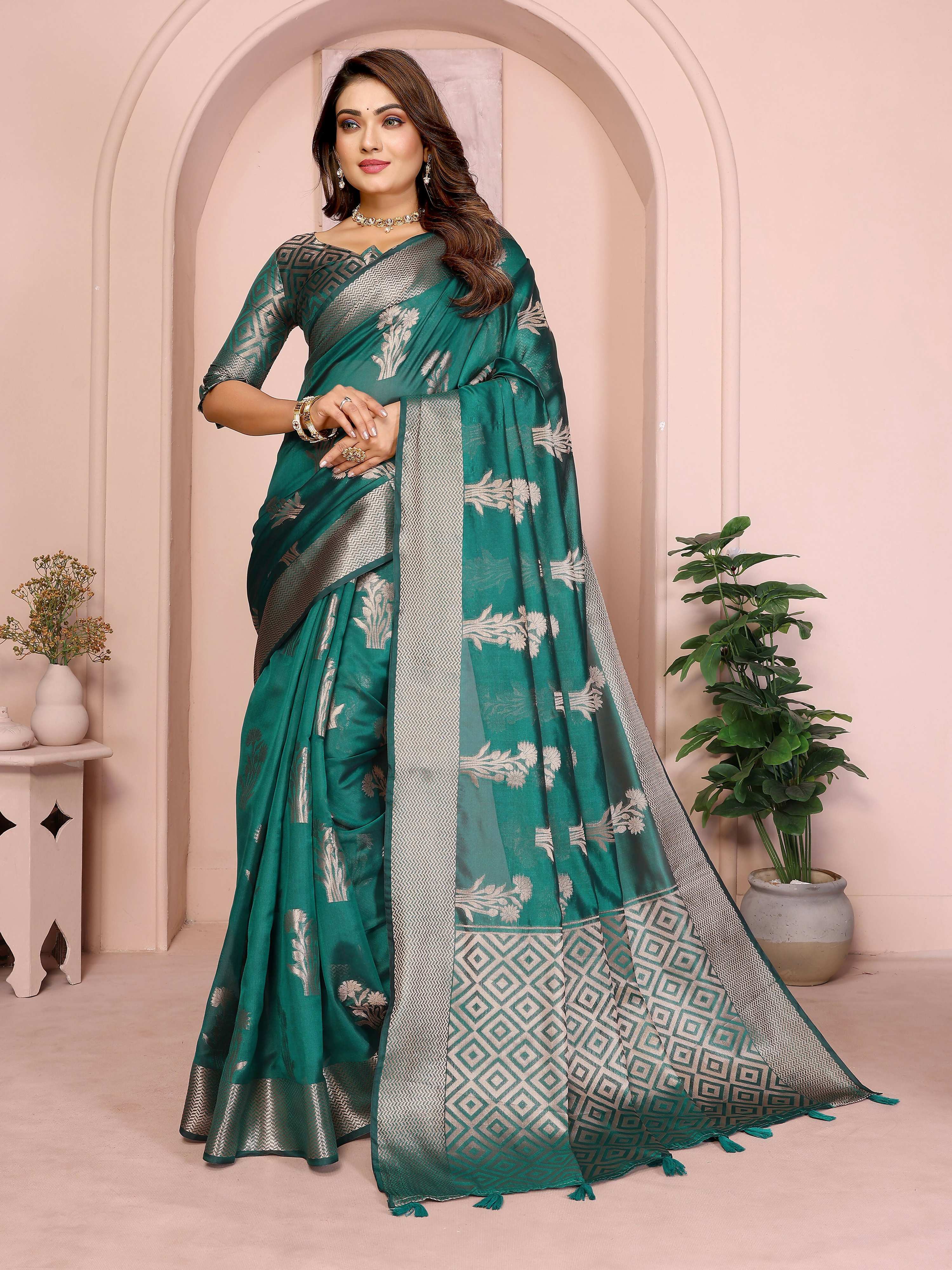 A beautiful green soft organza silk weaving saree with intricate details.