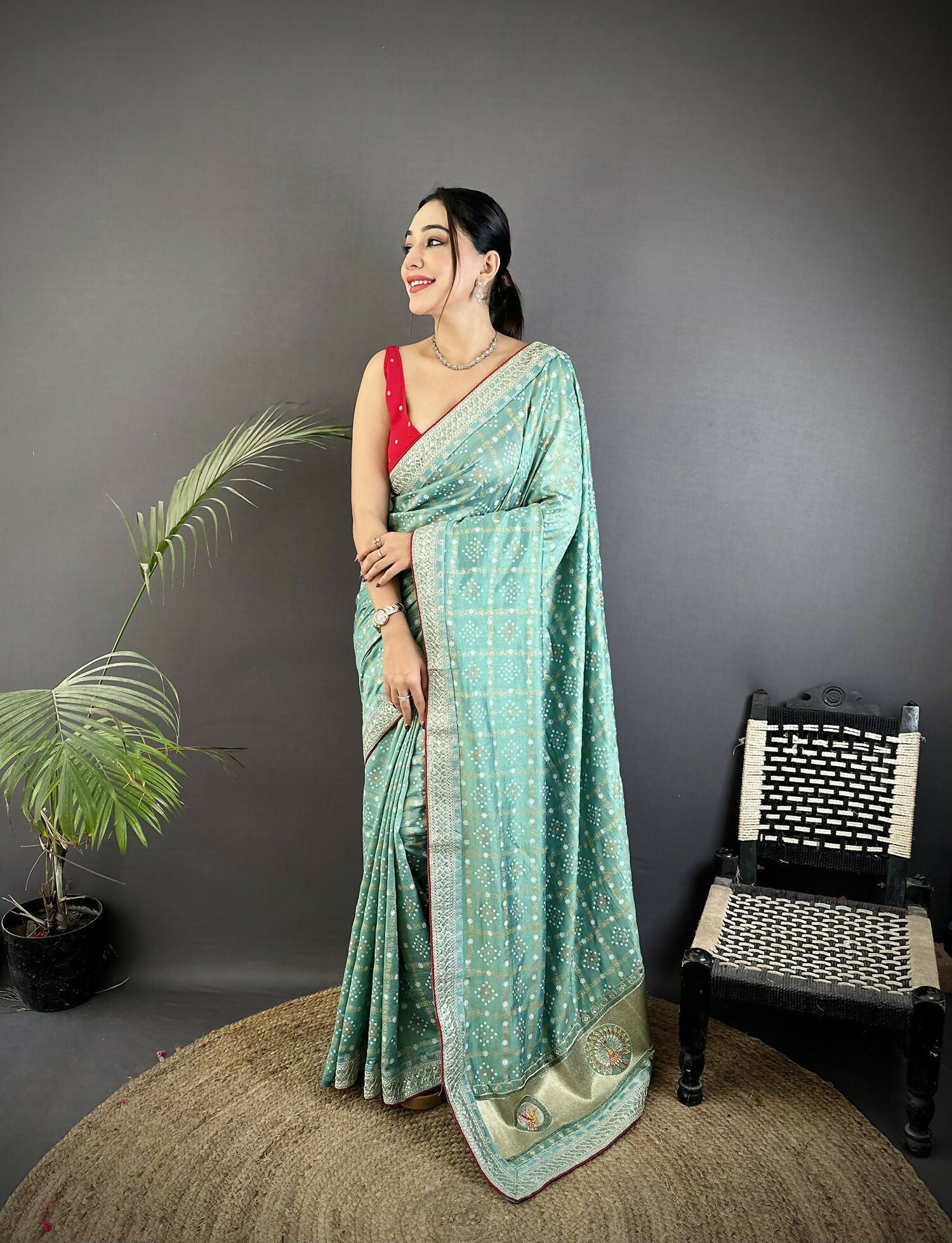 Sea Green Vichitra Silk saree featuring traditional Bandhani style prints.