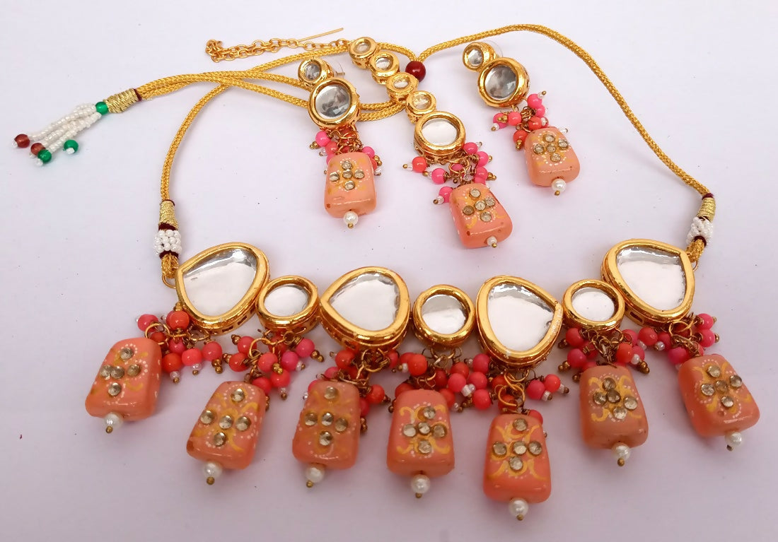 Peach Kundan stone necklace set with elegant gold-plated finish