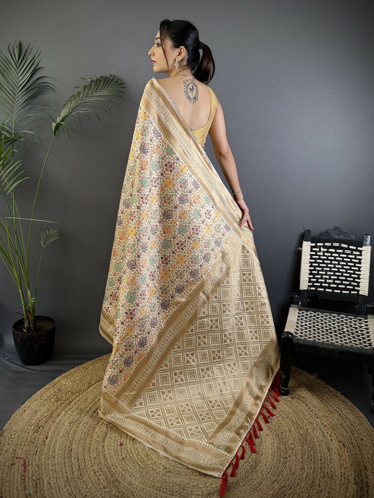 Cream Soft Silk Banarasi Saree with Intricate Floral Woven Motifs