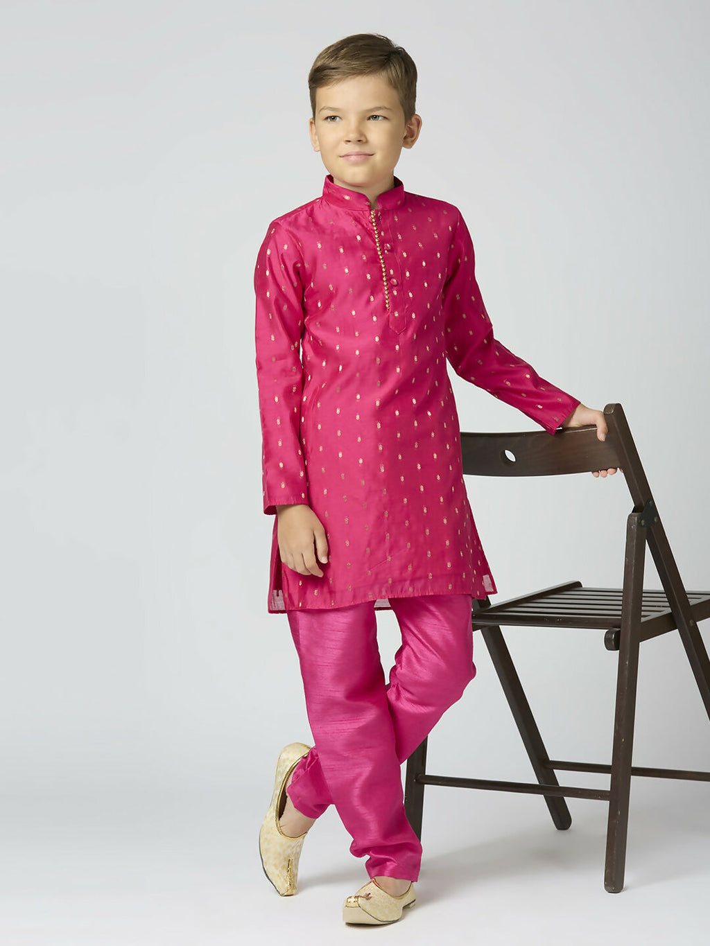 A vibrant Rani Pink Chanderi kurta and pyjama set with traditional butta embroidery for kids.