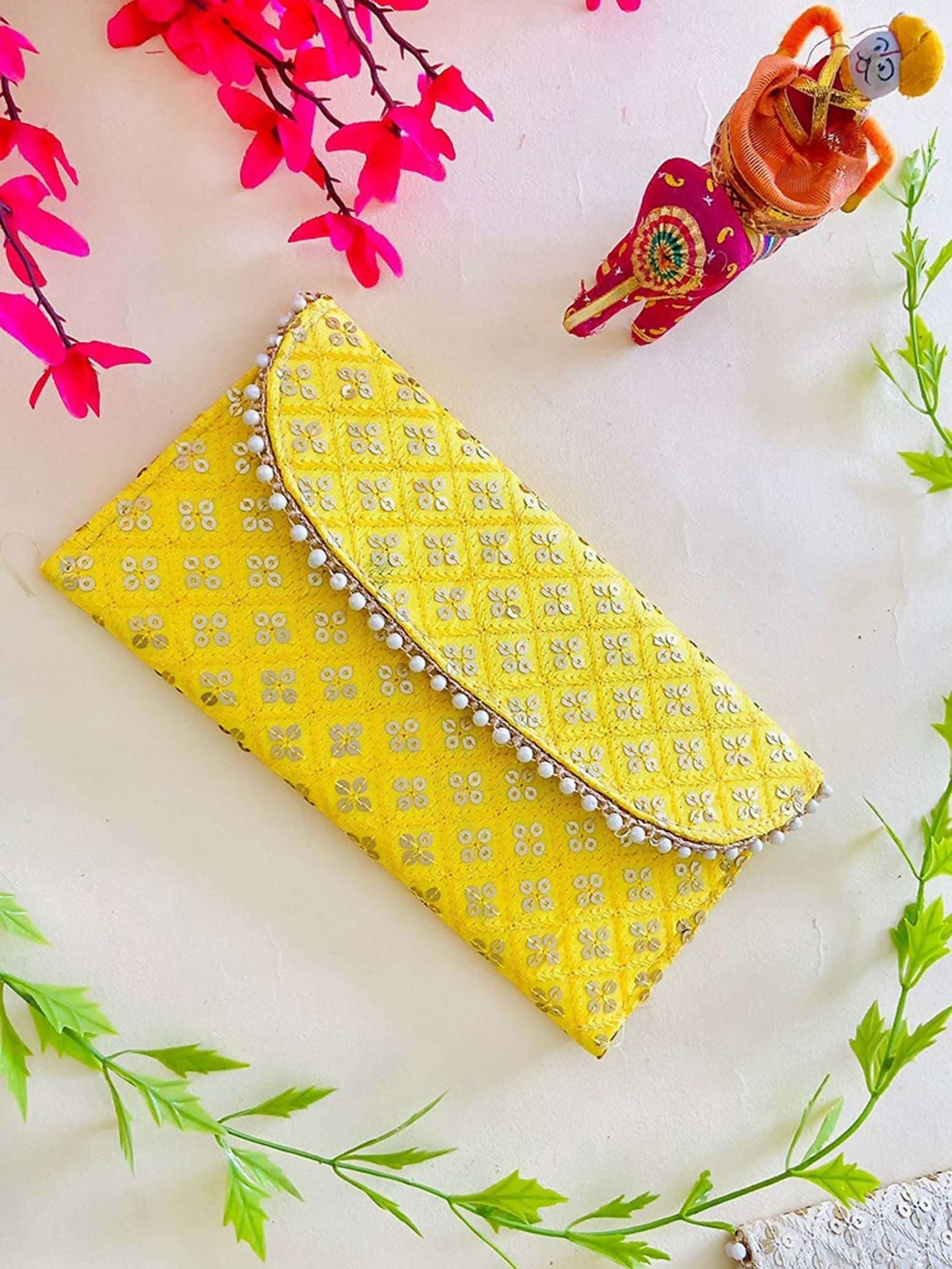 Yellow bridal purse made of synthetic fabric for wedding ceremonies