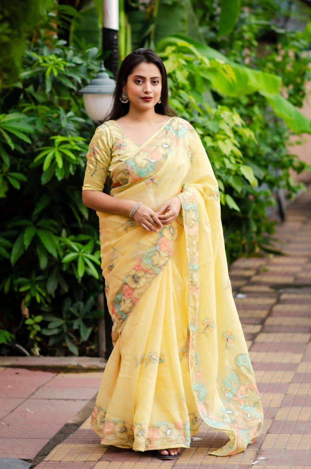 Yellow pure linen saree with ethnic motif embroidery and heavy phantom silk blouse