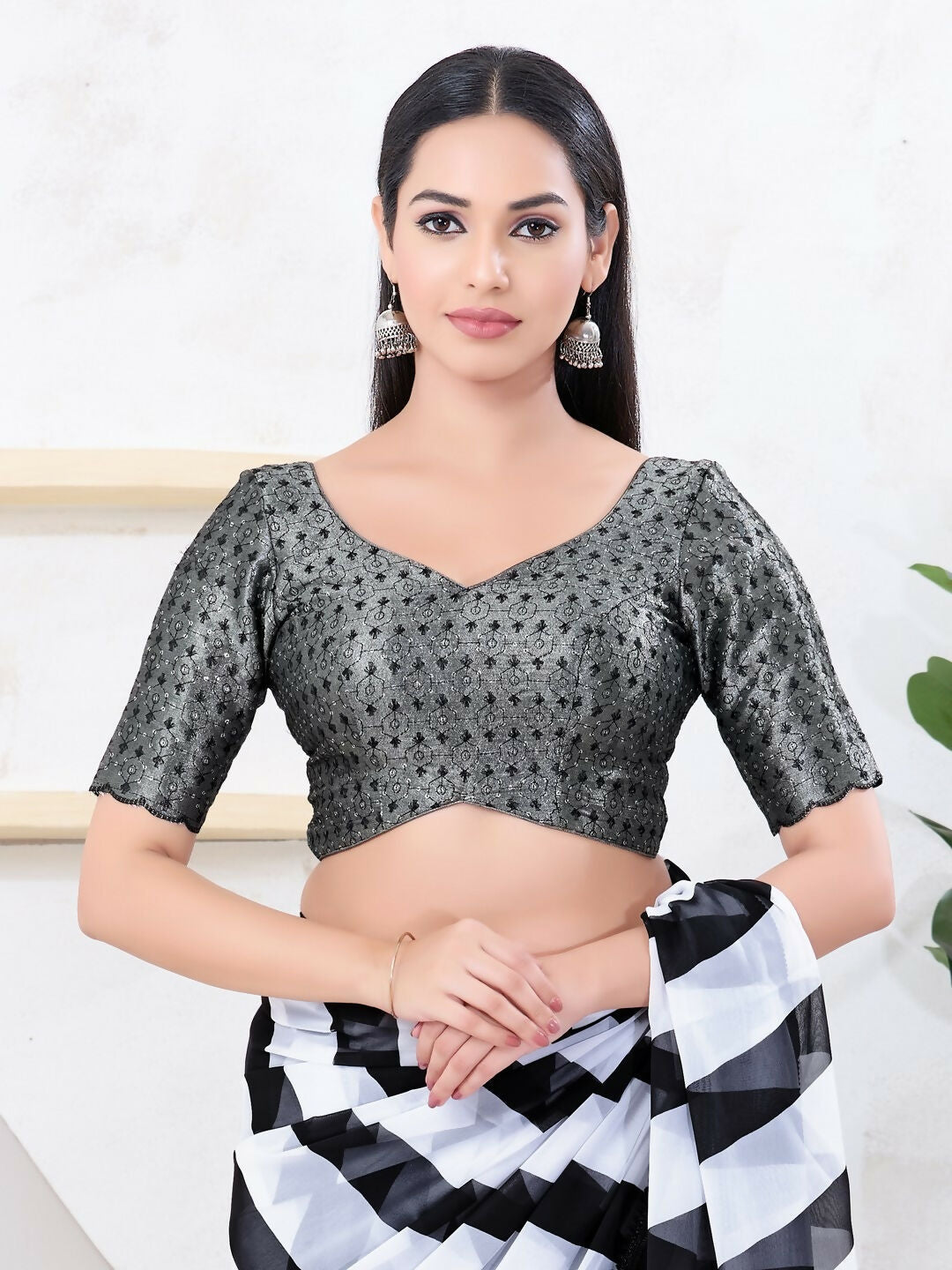 Black tissue fabric blouse featuring a sweetheart neckline and back-open design