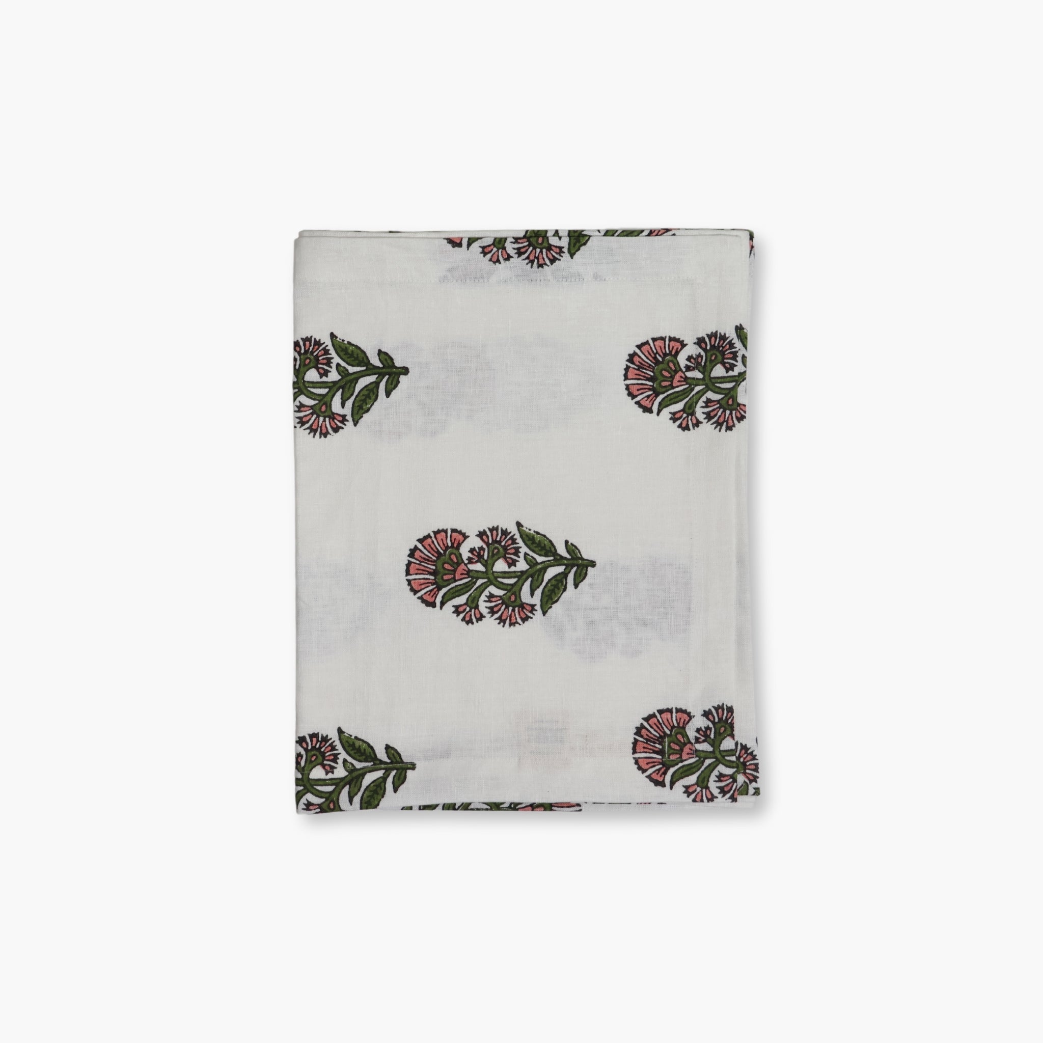 Begum hand-printed linen table runner in pink and green floral motif on a white background