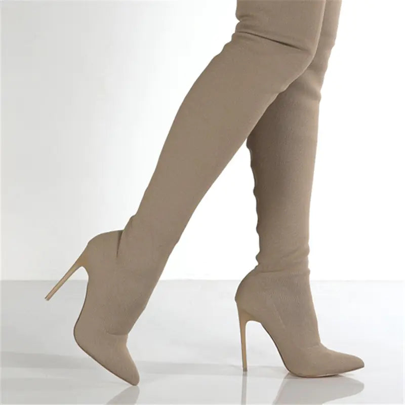 A pair of beige knit over-the-knee boots with a stiletto heel on a white background.