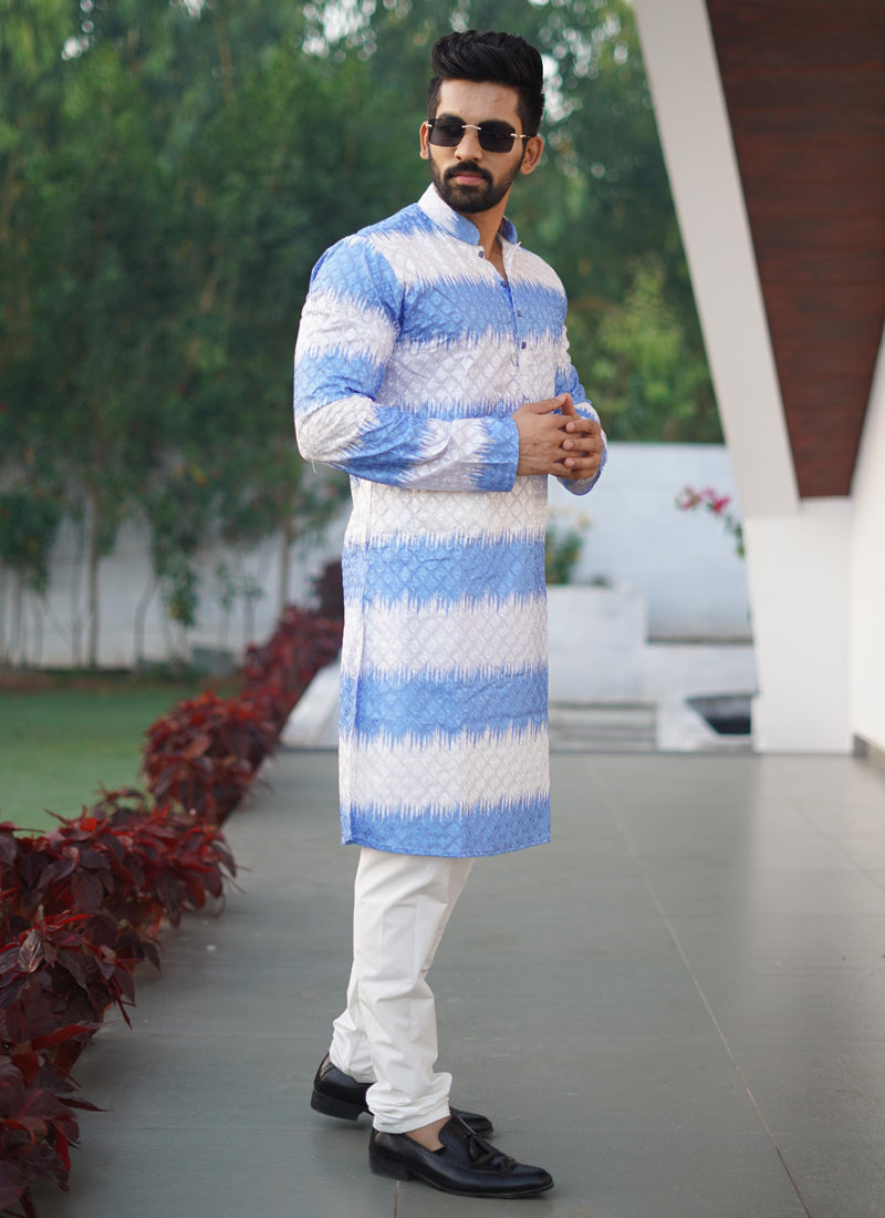 A men's blue cotton kurta featuring intricate embroidery and a shading print.