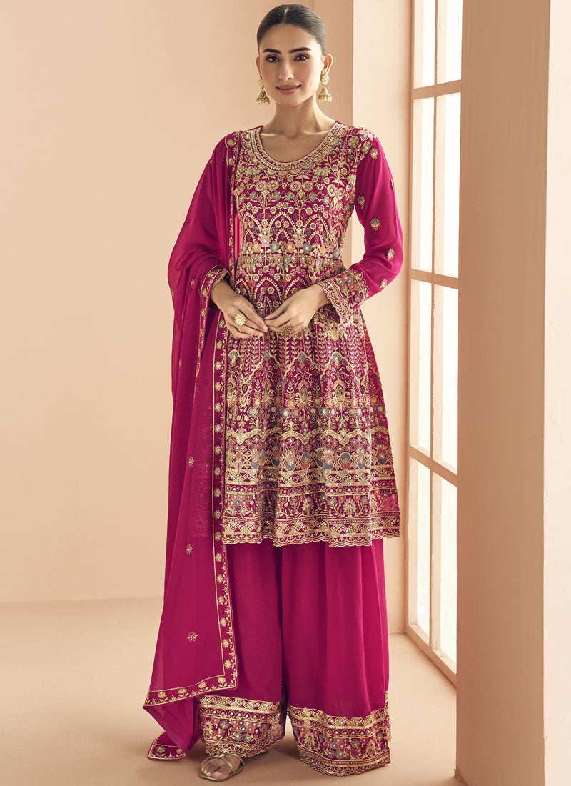Front view of a pink georgette designer palazzo suit with intricate gold embroidery