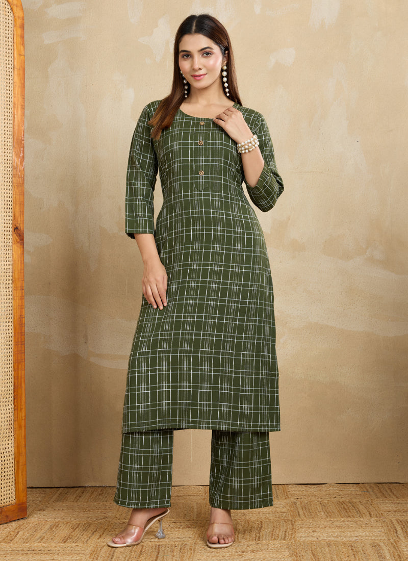 A stylish green printed cotton blend kurta pant set displayed on a model.