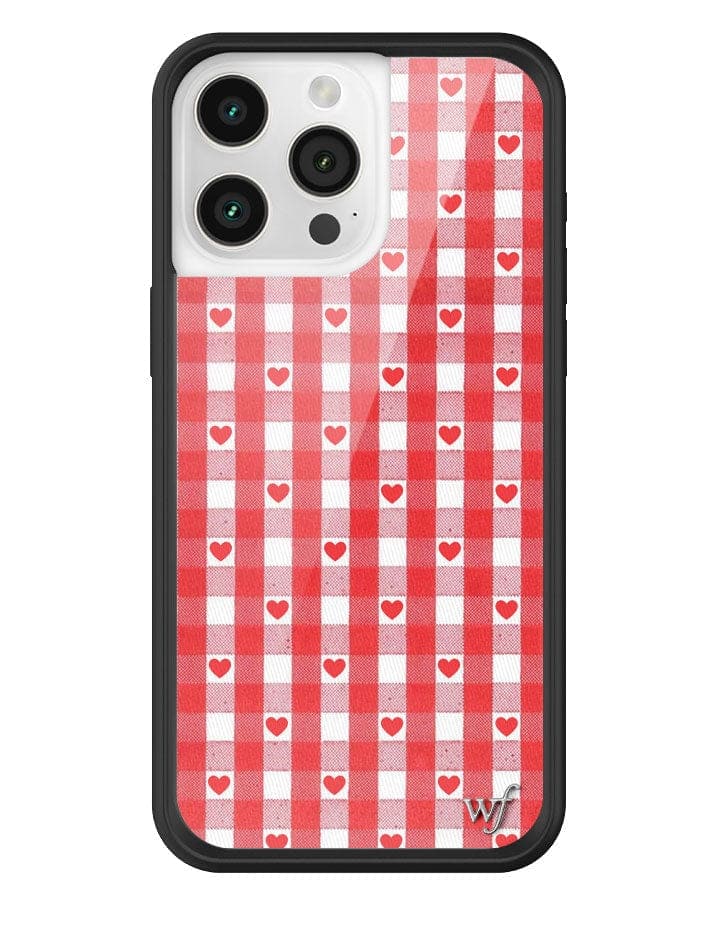 Red and white gingham pattern phone case with small red hearts and a black protective bumper.