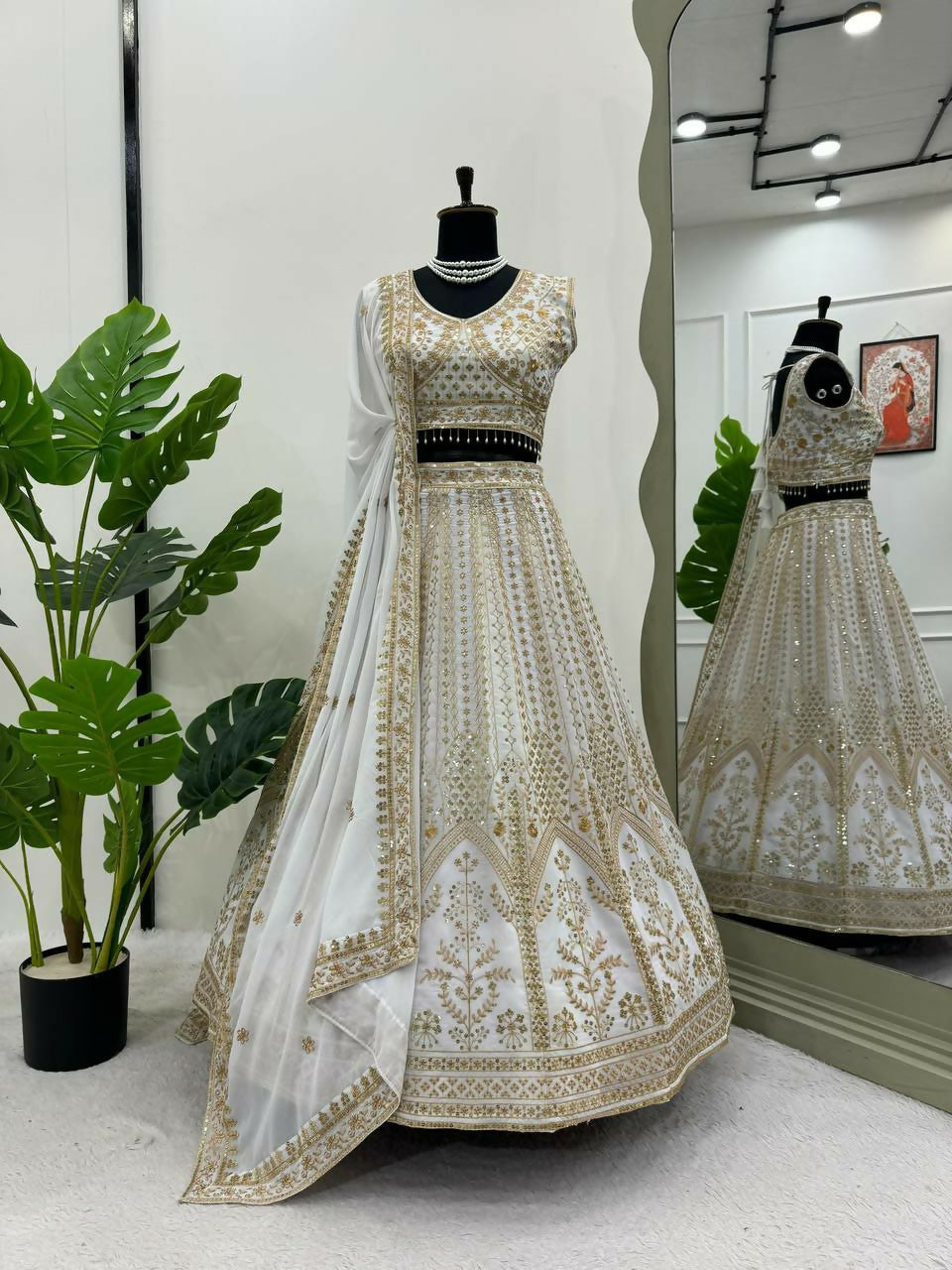 White faux georgette lehenga choli with sequin and thread embroidery, fully stitched with cancan
