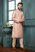 A stylish peach poly jacquard kurta pajama set for boys displayed against a neutral background.