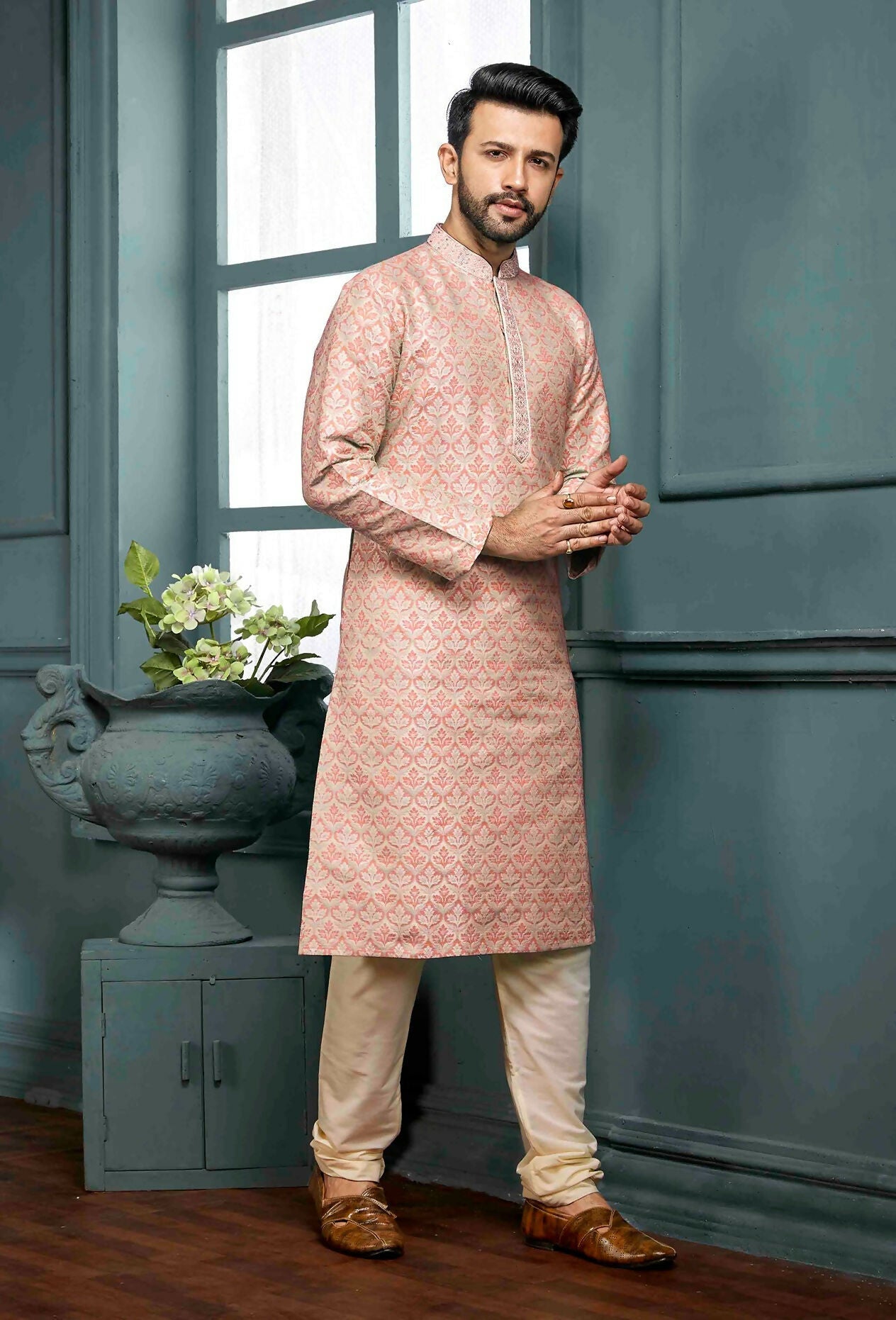 A stylish peach poly jacquard kurta pajama set for boys displayed against a neutral background.
