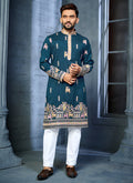 A blue soft silk A-line kurta with intricate multi-thread embroidery featuring a deer pattern on the daaman.