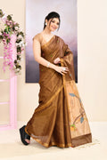 Brown tissue Jamdani saree with sophisticated embellishments and a refined, subtle sheen.