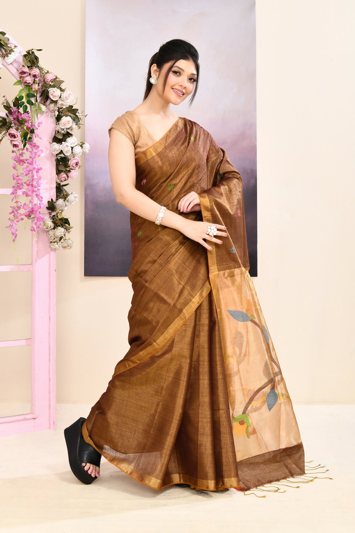 Brown tissue Jamdani saree with sophisticated embellishments and a refined, subtle sheen.