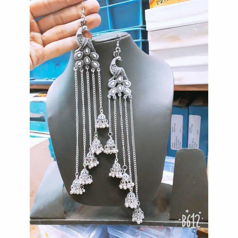 Peacock design bridal earrings featuring five cascading silver-tone jhumkas for a traditional look.