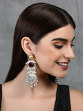 Long silver tone drop earrings featuring intricate patterns and sparkling accent stones.