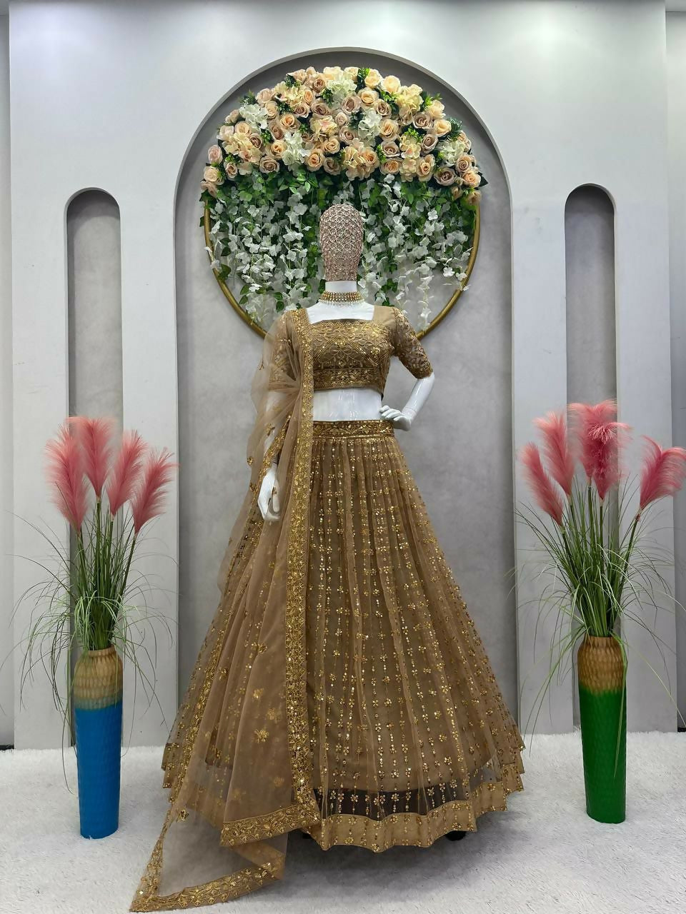 Beige butterfly net lehenga choli with heavy sequins and thread embroidery