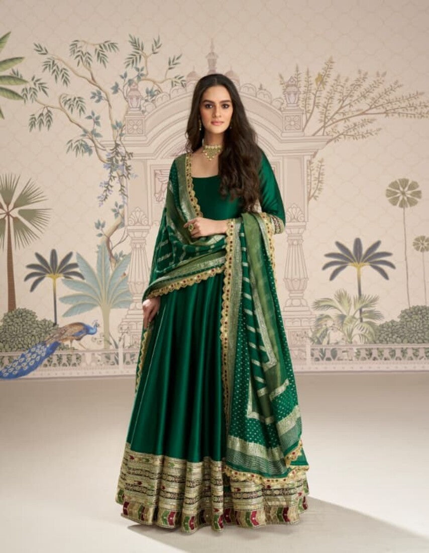 Aarshi Fashions elegant green silk wedding gown with matching dupatta and bottom wear.