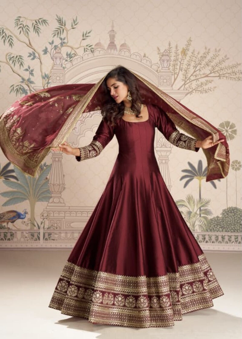 Aarshi Fashions maroon silk wedding gown with a elegant floor-length silhouette for formal events.
