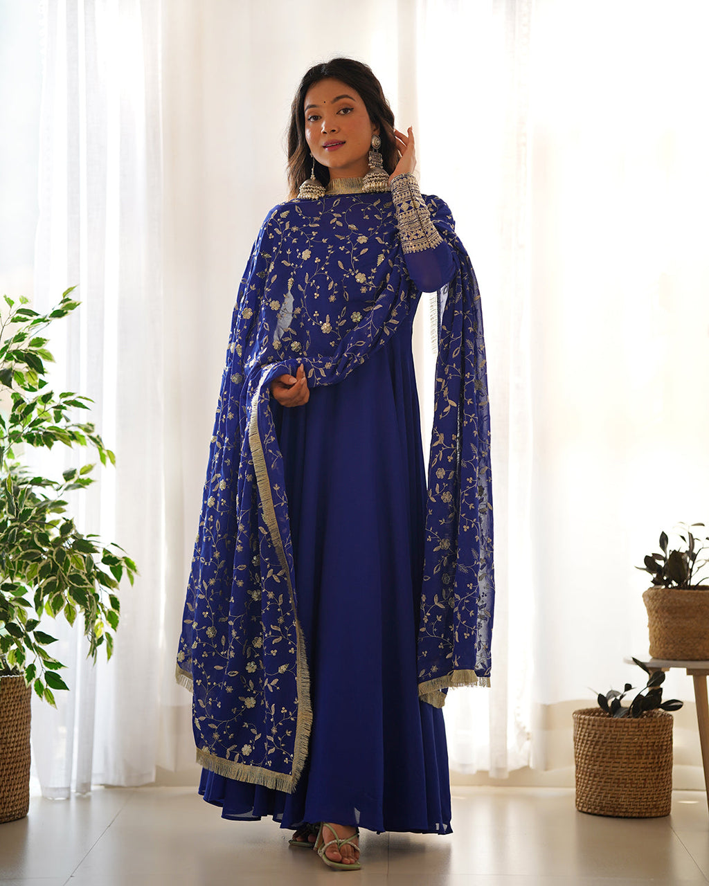 Blue Georgette Anarkali gown with sequin and zari work, paired with matching pants and dupatta