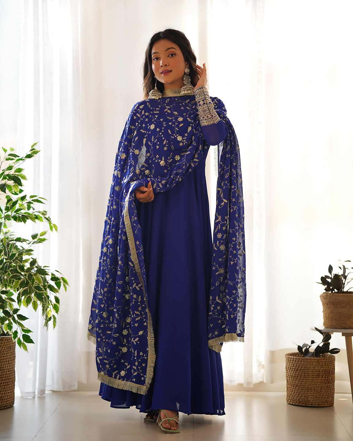 Blue Georgette Anarkali gown with sequin and zari work, paired with matching pants and dupatta