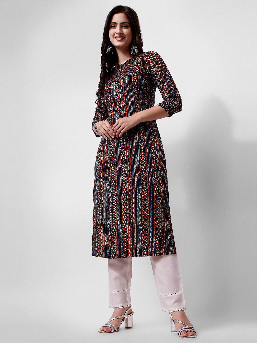 Woman wearing a multicolor ethnic motif printed rayon kurta with 3/4th sleeves and a round neck