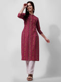 Woman wearing a multicolor ethnic motif printed rayon kurta with 3/4th sleeves and a round neck