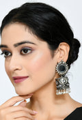 Johar Kamal silver oxidised jhumka earrings with intricate kundan stone detailing.