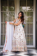 Elegant off-white faux georgette Anarkali suit with detailed thread and sequin embroidery.
