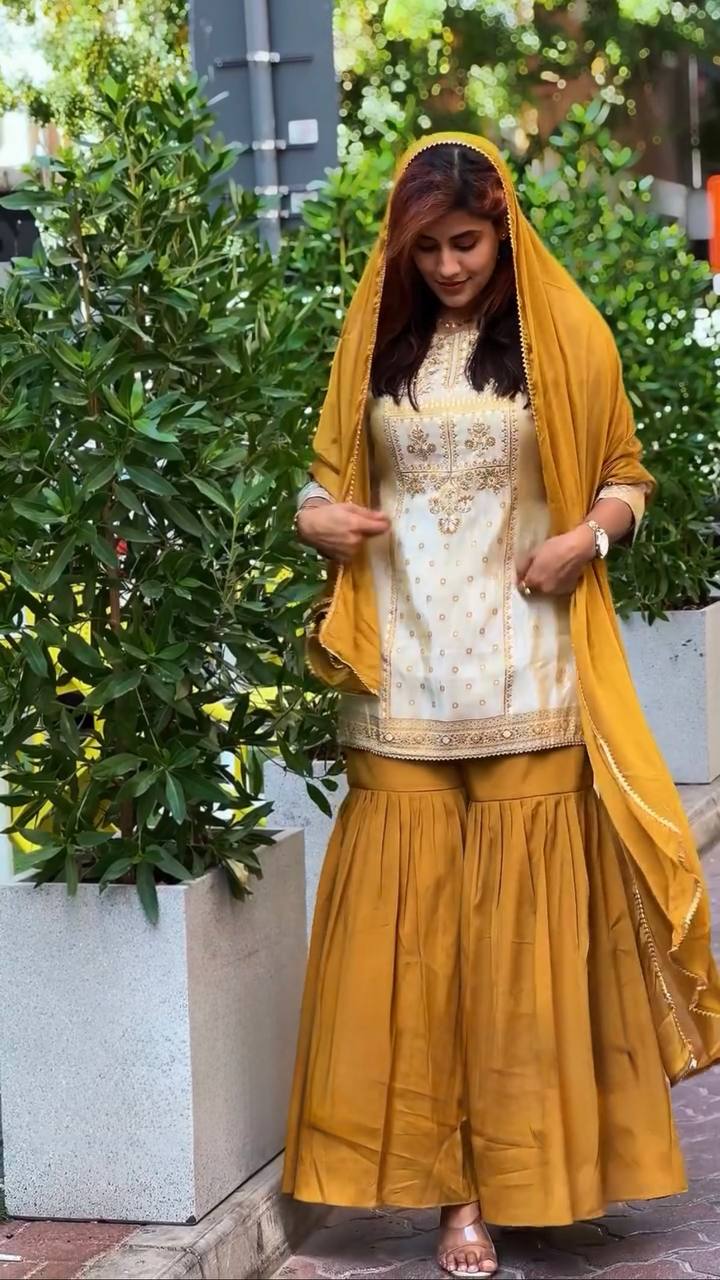 Off White Crepe Sharara Suit with intricate thread and sequin embroidery details
