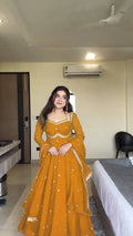 Bright yellow faux georgette Anarkali suit with sequence detailing