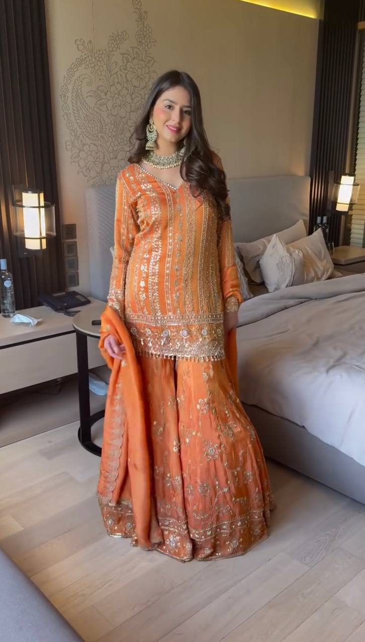 Elegant orange georgette sharara suit with intricate thread and sequin embroidery detail