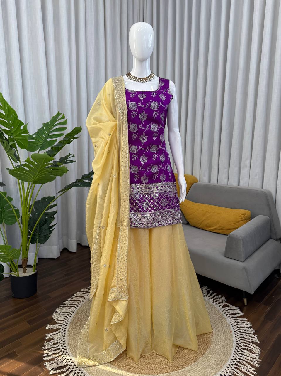 Purple jacquard palazzo suit with decorative thread and sequence embroidery.