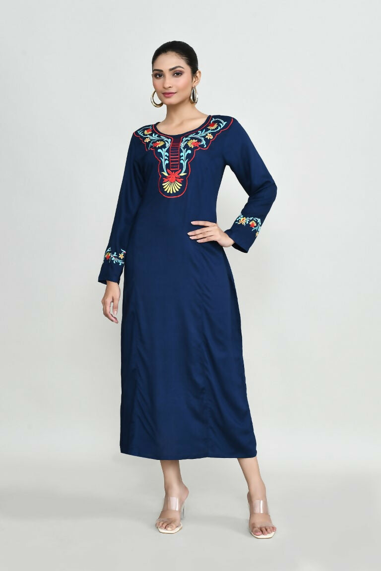 A blue rayon tunic featuring delicate embroidery details, showcased as a versatile wardrobe staple.