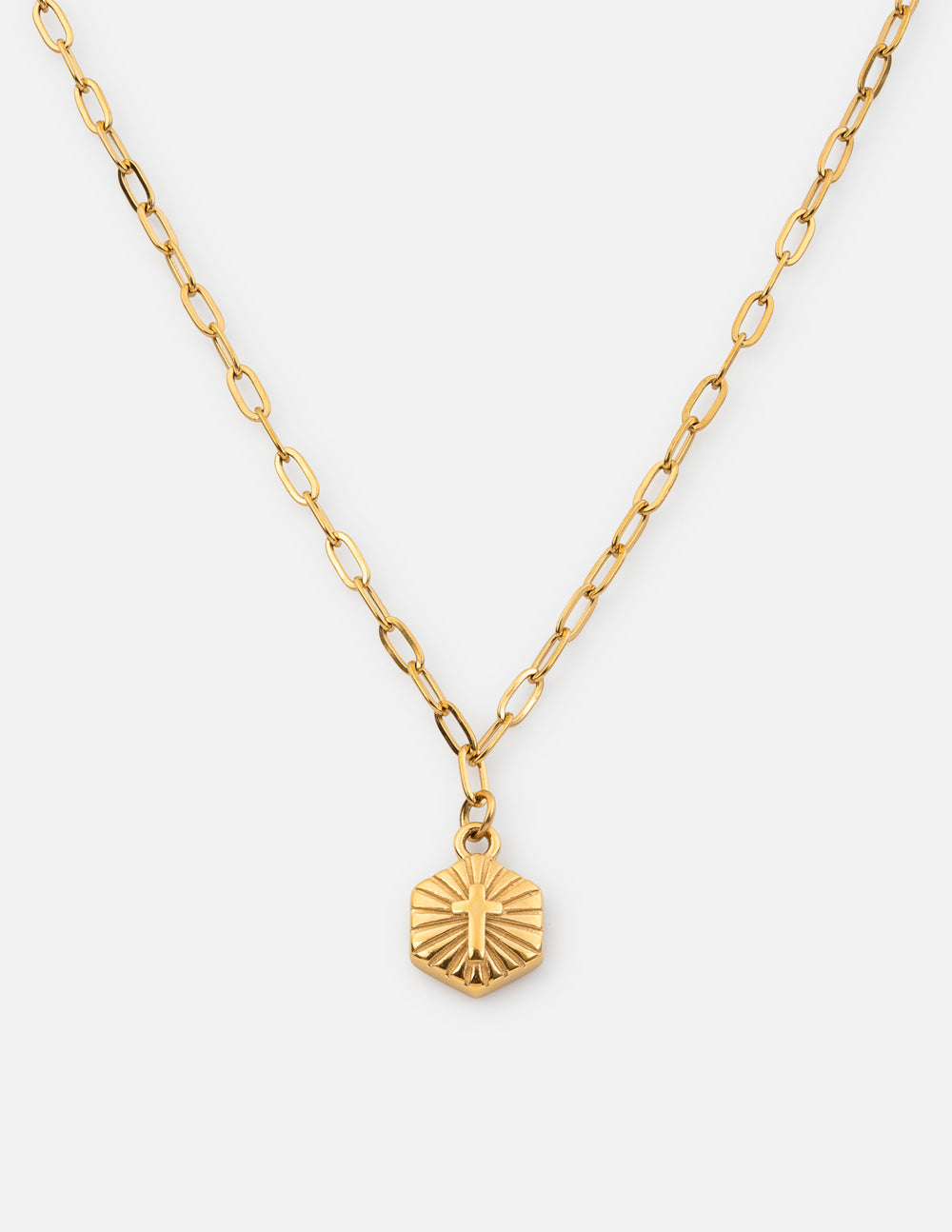 Minimalist Radiant Cross necklace in bright gold on a clean background