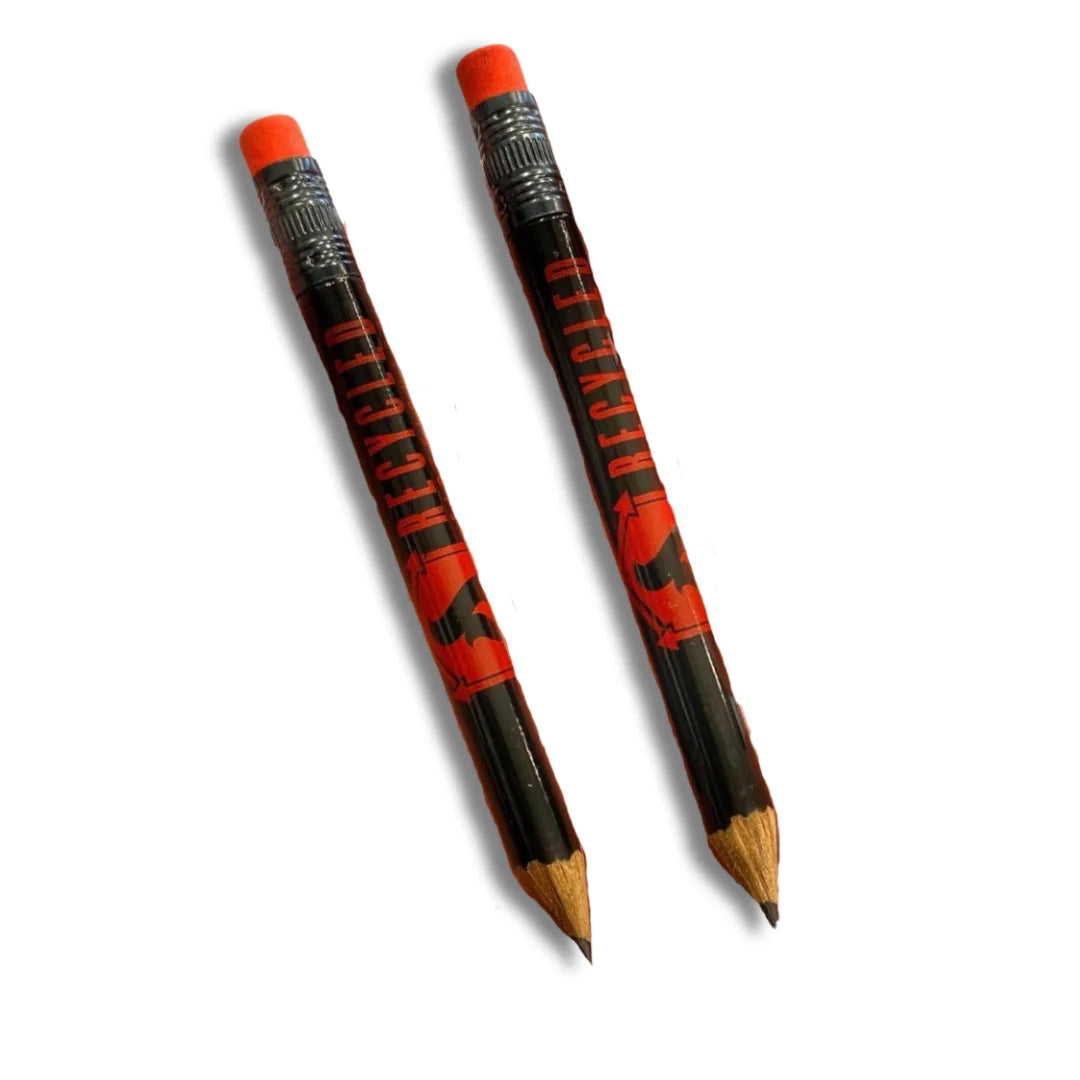 A sleek black Recycled Firefighter pencil with bold RF branding resting on a desk surface.