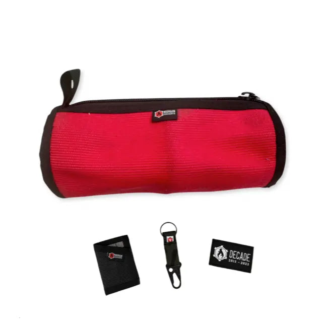 Red fire hose dopp kit bundle with Sergeant wallet, keychain clip, and patch on a neutral background.